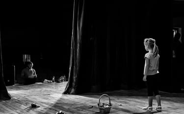 Young girl on stage waiting for her prompt to begin her performance