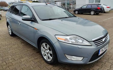 a car parked in a parking lot with a car parked in front of it