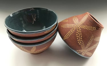 Ice cream bowls in red stoneware, glazed on inside, dotted on outside
