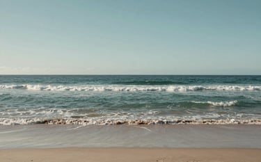 A wide, peaceful landscape of an Australian coastline with gentle waves and soft sand under a clear, pale sky. The composition is grounded and sophisticated, using muted teal and grey-green tones to evoke confidence.