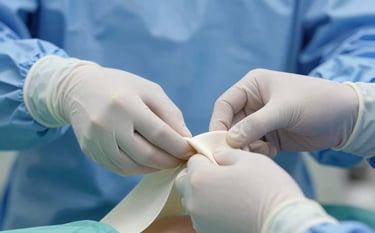 Close-up of a specialist's hands wearing surgical gloves, adjusting a clean medical compression garment. Professional lighting with a focus on precision and expertise. Incorporates #50727B in the background textiles.