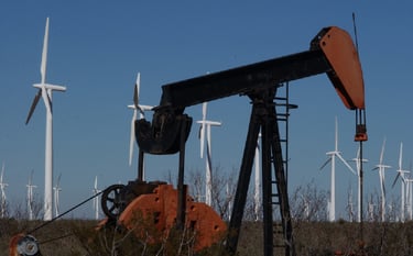 Pumpjack and Wind Turbines in a field