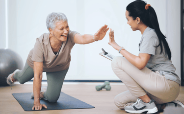 An older women doing physical therapy. 