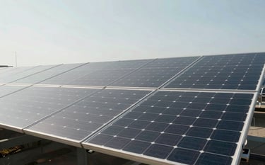 Expert professionalism. A wide-angle, high-resolution shot of a modern solar panel array under a clear sky. The lighting is bright and clean, emphasizing strategic innovation. The composition follows the rule of thirds with architectural precision. Subtle tones of #0B1A2A and #A8C6CF are reflected in the glass surfaces, conveying reliability.