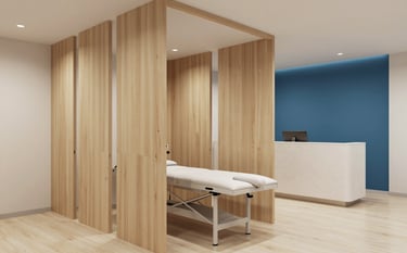 A high-quality 3D architectural rendering of a modern physiotherapy clinic interior in Western European / French style. The space features light wood partitions, a professional treatment table, and a minimalist reception area with a blue accent wall. Calm, professional, and healing ambiance.