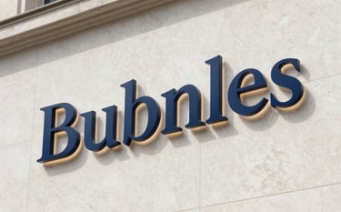 Backlit blue Bubnles logo sign mounted on a textured beige marble wall.