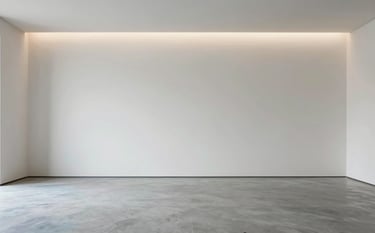 Wide shot of a minimalist interior space showing finished smooth walls in soft off-white and polished concrete flooring in light blue grey. Subtle recessed lighting creates a sophisticated and professional atmosphere. The scene represents perfect craftsmanship and engineering precision.