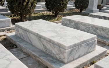 A high-angle professional photograph of a pristine, white marble grave in an Istanbul cemetery. The surroundings are clean, with dark green trees in the background and soft morning sunlight. The focus is on the cleanliness and respectful maintenance of the site.