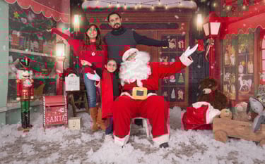 a man and woman in santa claus costume posing for a photo
