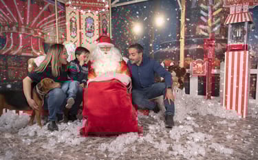 a family posing for a photo with santa claus claus claus claus claus claus claus claus