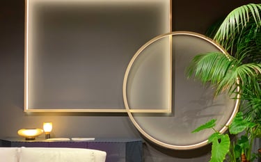 interior design elements on a wall showing accent lights with golden frames