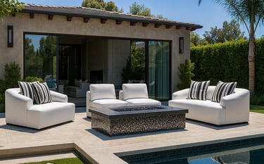 Elegant white sofa set by Solo Home Decor near a pool with striped pillows, showcasing a modern luxury backyard design.