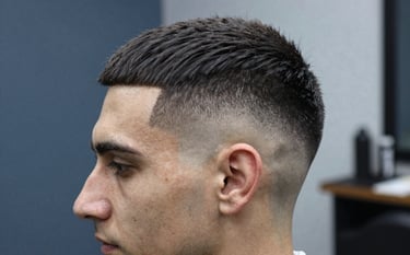 Close-up of a sharp, professional skin fade haircut on a man, emphasizing clean lines around the temple and ear. Soft studio lighting, masculine atmosphere, European / Romanian barber shop setting, featuring Slate Blue and Light Gray tones in the background.