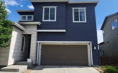 Premium exterior house painting on modern siding and stone masonry by Denver Metro's expert painters