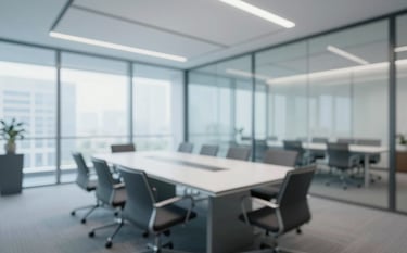 A wide-angle view of a bright, modern corporate boardroom with glass walls and professional furniture. Tones of #F5F7F8 and #687C92 dominate. Reassuring, stable, and efficient aesthetic.