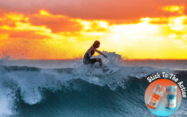 a man riding a surfboard on a wave