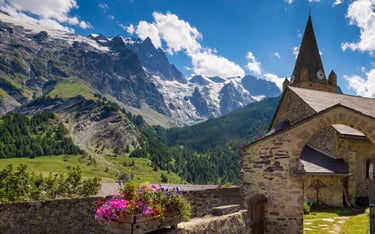 Alps France village church mountains snow blue sky