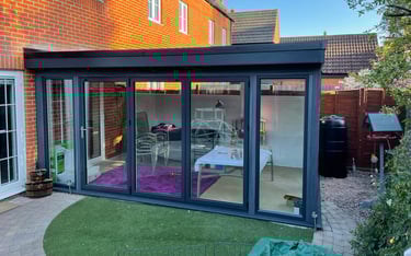 Composite wood extension with bi-folding doors