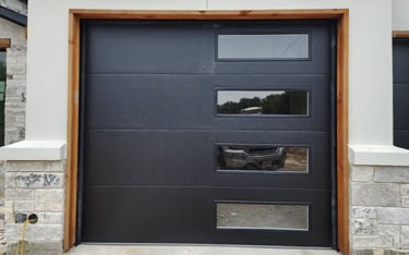 Black flush style with tinted windows on the right hand side installed by A's garage doors.