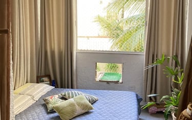 a bed room with a bed and a window