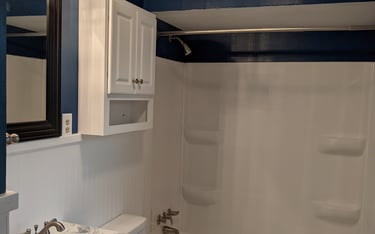 bathroom remodel using carpentry, epoxy, re-glazing and new product installation