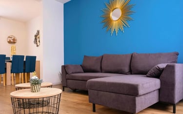 Bright living room with corner sofa, serviced accommodation for business stays