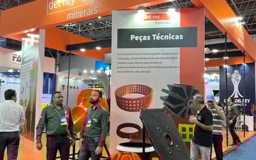 a group of people standing around a display of a variety of products