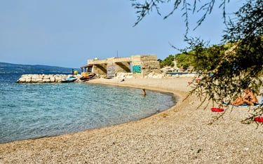 The photo shows Rape Beach Centar on a summer day.