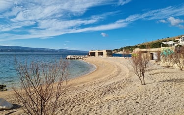 The photograph shows the central area of Rape Beach, one of the top beaches in Croatia.
