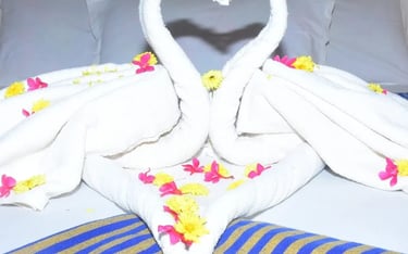 Romantic swan towel decoration at Hotel Aishwariyam Thirukadaiyur hotel near Abirami Temple