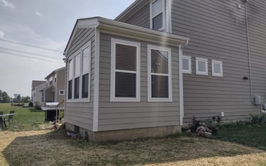 Enclosed sunroom addition protecting from weather and insects in Columbus, Ohio