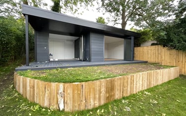 Large composite room in dark grey, used as gym