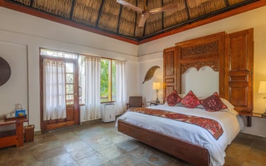 Experience the authenticity of Belize in this inviting cottage Deluxe King Room. 