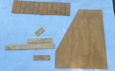 Cut and stained pieces of wood