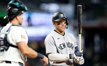 - APRIL 01: Aaron Judge #99 of the New York Yankees looks at Cal Raleigh #29 of the Seattle Mariners in Seattle, Washington