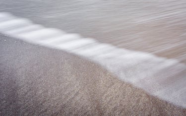 Ocean streaks on a beach in the Faroe Islands