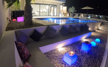 Villa Fay pool with a lounge area at night