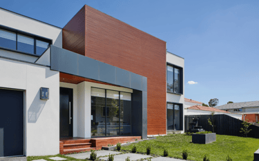 a house with a large backyard area and a large lawn