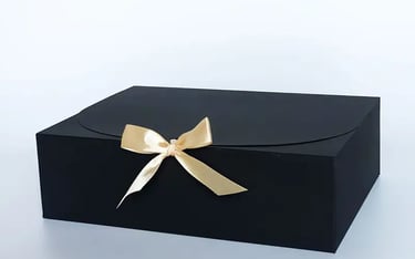 gift box with black and gold bow