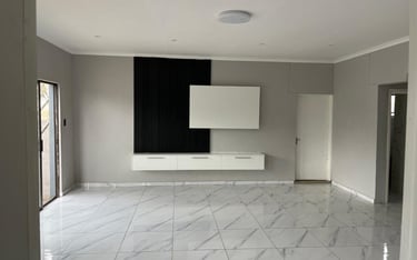 a living room with a large marble floor, House Construction Frans-del Investment CC Construction com
