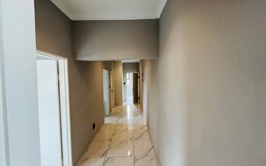 a hallway with a marble floor and a marble floor, House Construction Frans-del Investment CC Constru