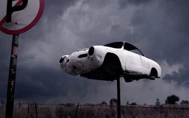 Abandoned fine art photography print from Martin Osner’s iconic collection featuring a vintage car mounted on a pole