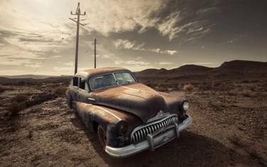 Abandoned vintage car on a hill near Klaarstroom in Martin Osner’s Abandoned No.36 photograph.