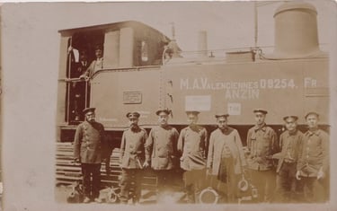 Photograph of German railwaymen in front of a locomotive at Valenciennes station in 1915.
