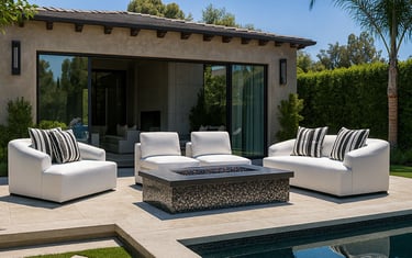 Elegant white sofa set by Solo Home Decor near a pool with striped pillows, showcasing a modern luxury backyard design.