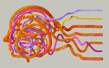 a bunch of coloured yarn jumbled in the shape of a head