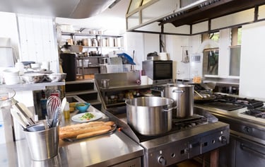 a kitchen with a stove top and a potted potted with bread