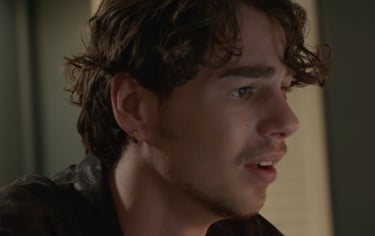 a man with a black shirt and a black shirt