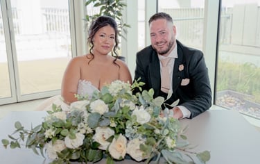 Bride and groom holding hands with wedding rings at Teesside wedding