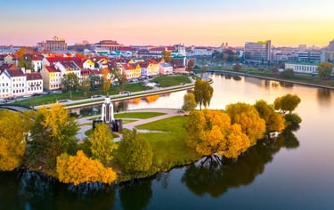 Aerial view of the Island of Tears and Trinity Hill in Minsk, Belarus, during a golden autumn sunset.
